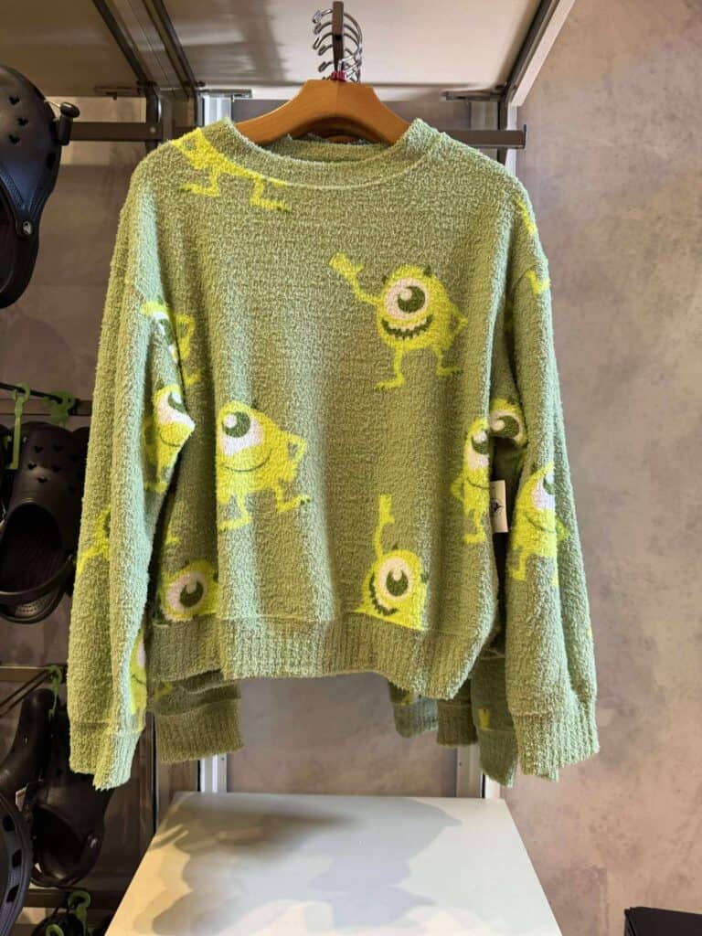 Bright, cozy sweater featuring Mike Wazowski from Monsters Inc. with playful design.