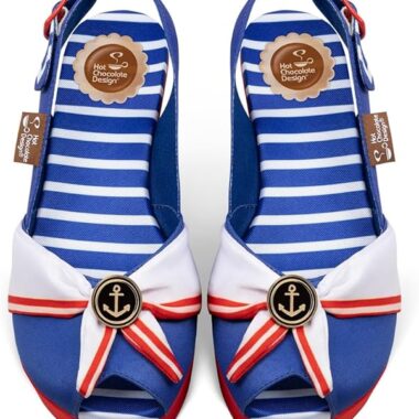 Bright blue and white striped Disney-themed nautical shoes with anchor emblem and bow detail.