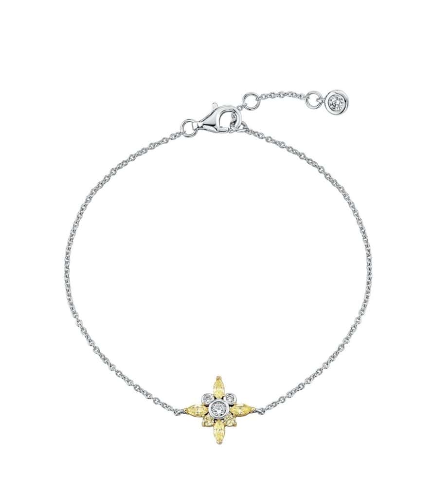 Stylish Disney jewelry bracelet featuring a delicate floral charm with sparkling gemstones.
