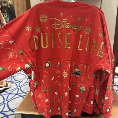 Festive Disney Cruise Line holiday sweatshirt with snowflakes and ornaments design.