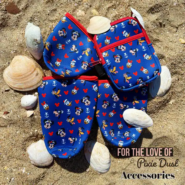 Bright blue Mickey Mouse-themed beach accessories set with shells around, perfect for Disney fans.