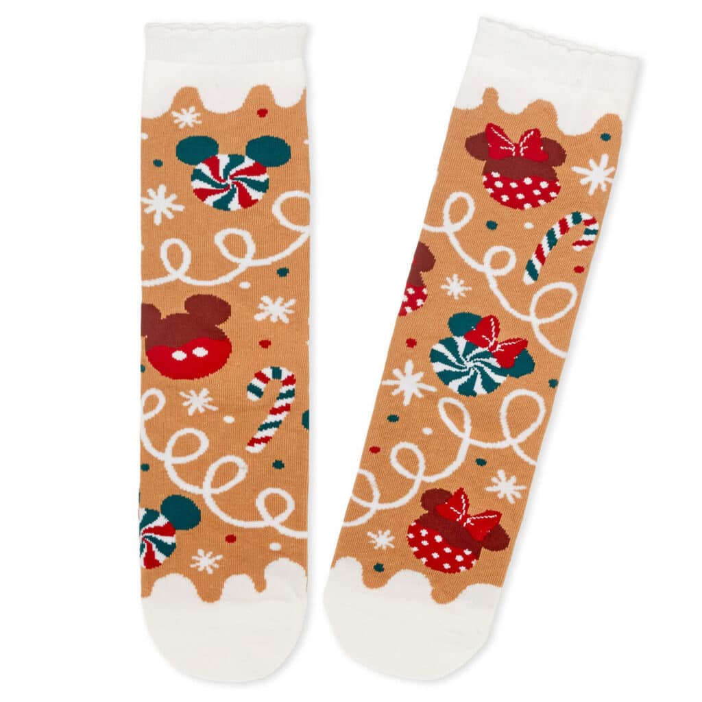 Colorful Disney holiday socks featuring Mickey and Minnie Mouse with candy cane and snowflake designs.