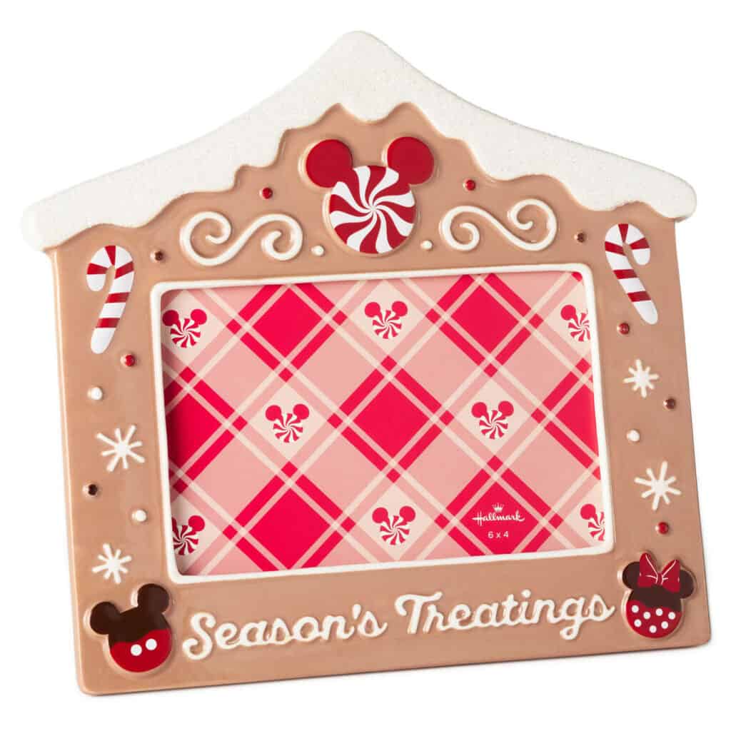 Decorative holiday-themed Disney gingerbread house picture frame with Mickey Mouse details.