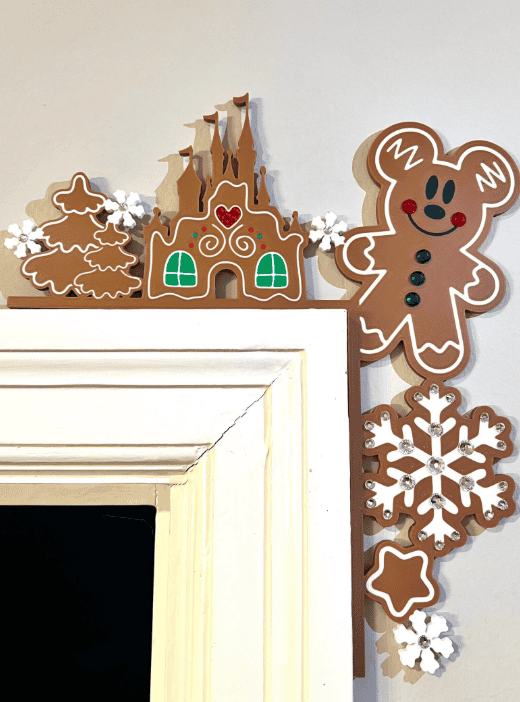 Colorful gingerbread and snowflake decorations for holiday wall decor.