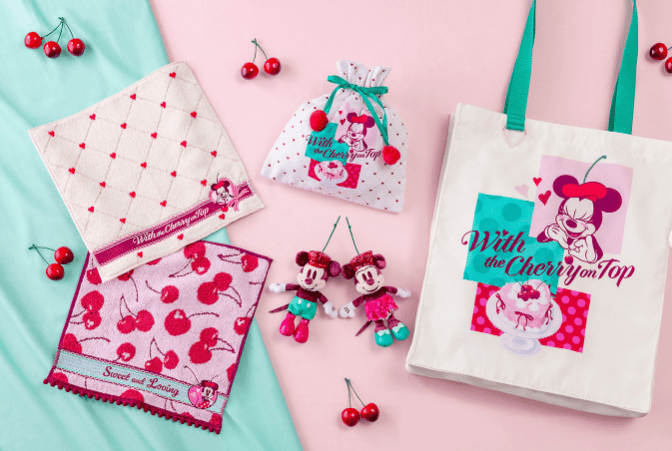 Colorful Disney-themed cherry print accessories and tote bag featuring Minnie Mouse.