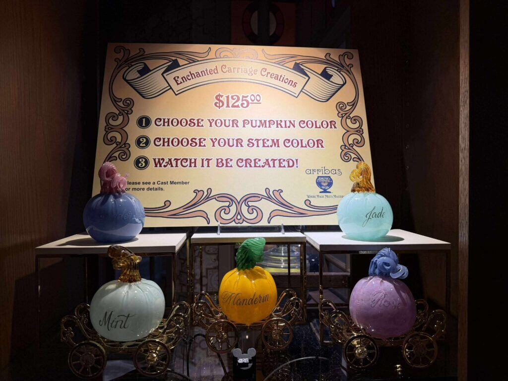 Colorful ceramic pumpkin carvings with custom stem colors and names for Disney fans.