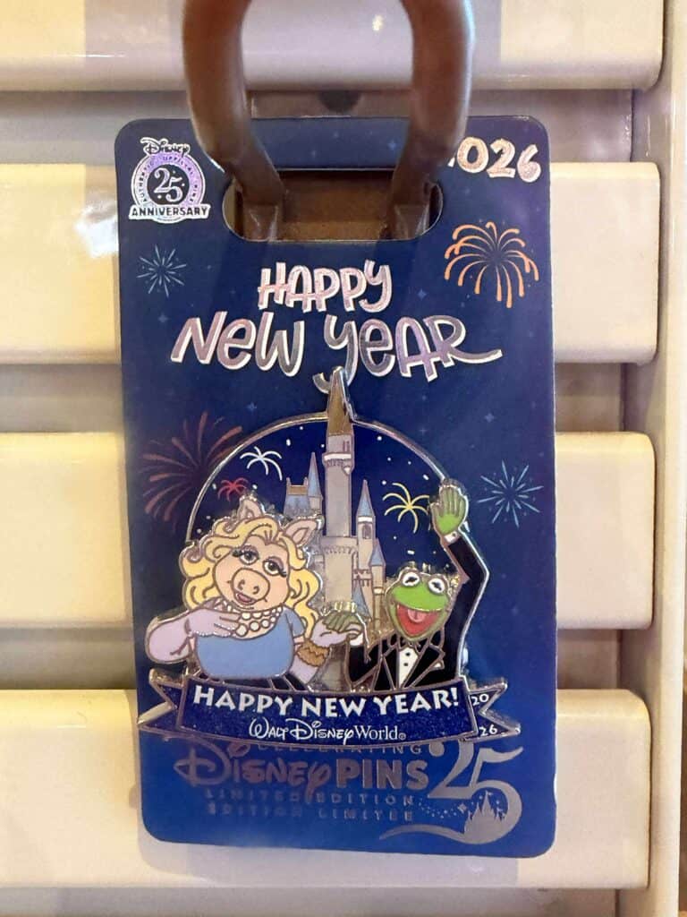 Colorful Disney 25th anniversary pins with Mickey Mouse, Tinker Bell, and fireworks celebrating the new year.