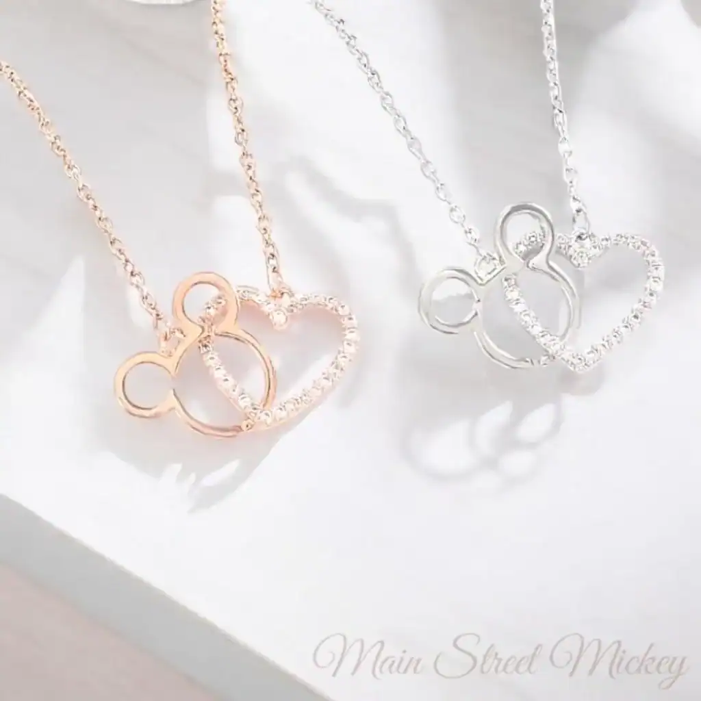 Elegant Mickey Mouse heart pendant necklaces in rose gold and silver. Perfect Disney-inspired jewelry for fans.