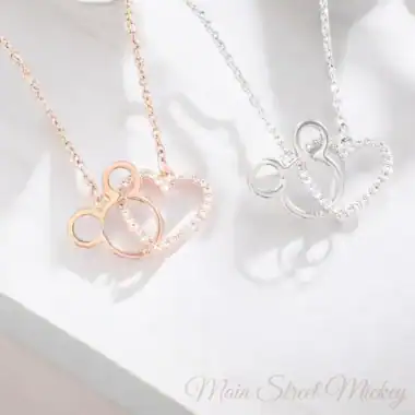 Elegant Mickey Mouse heart pendant necklaces in rose gold and silver. Perfect Disney-inspired jewelry for fans.