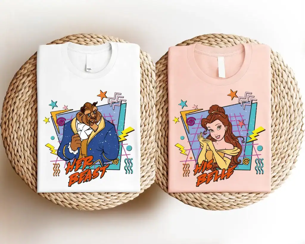 Colorful Disney Beast and Belle graphic tee shirts with vibrant designs and fun elements.