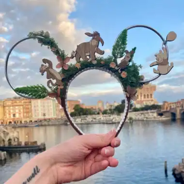 Disney-inspired woodland character headband with floral and greenery details, perfect for Disney fans.