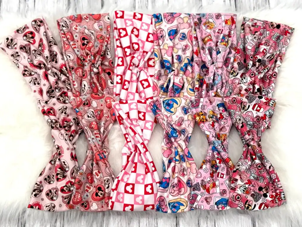 Colorful Disney-themed hair accessories featuring Mickey and Minnie Mouse, love hearts, and playful patterns for kids and adults.