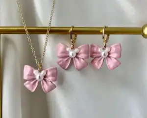 Pink bow and pearl earrings with matching necklace, Disney-inspired fashion accessories.