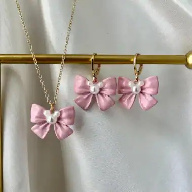Pink bow and pearl earrings with matching necklace, Disney-inspired fashion accessories.