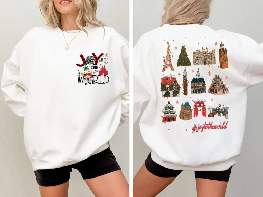 Disney Christmas sweatshirt featuring joyful design with holiday icons and "#joytotheworld" hashtag, ideal for festive occasions.
