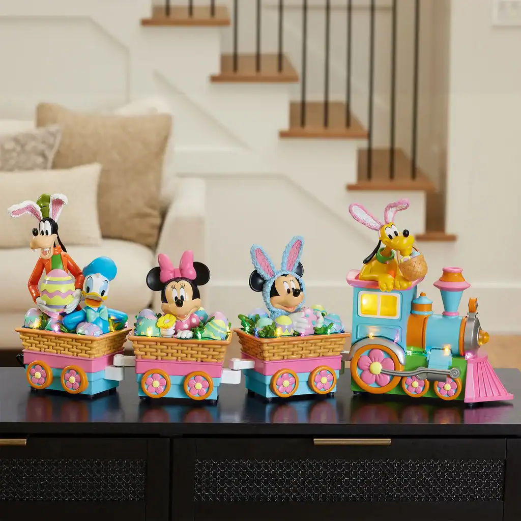 Colorful Disney Easter train with Mickey, Minnie, Goofy, and Pluto characters, perfect for Disney holiday décor.