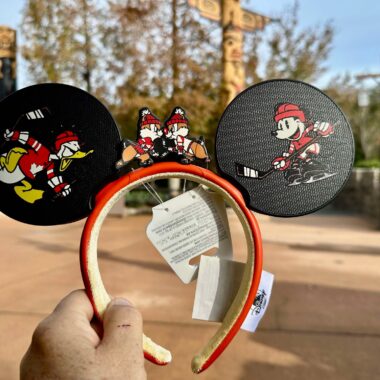 Mickey Mouse ears headband featuring cartoon sports graphics, ideal for Disney merchandise enthusiasts.