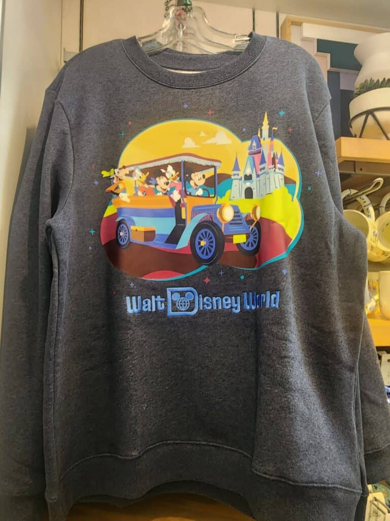 Disney Mickey Mouse trip-themed sweatshirt featuring Disneyland castle and characters.