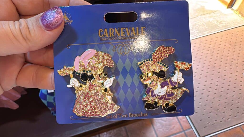 Colorful Disney collectible brooch set featuring Minnie and Mickey in festive costumes.