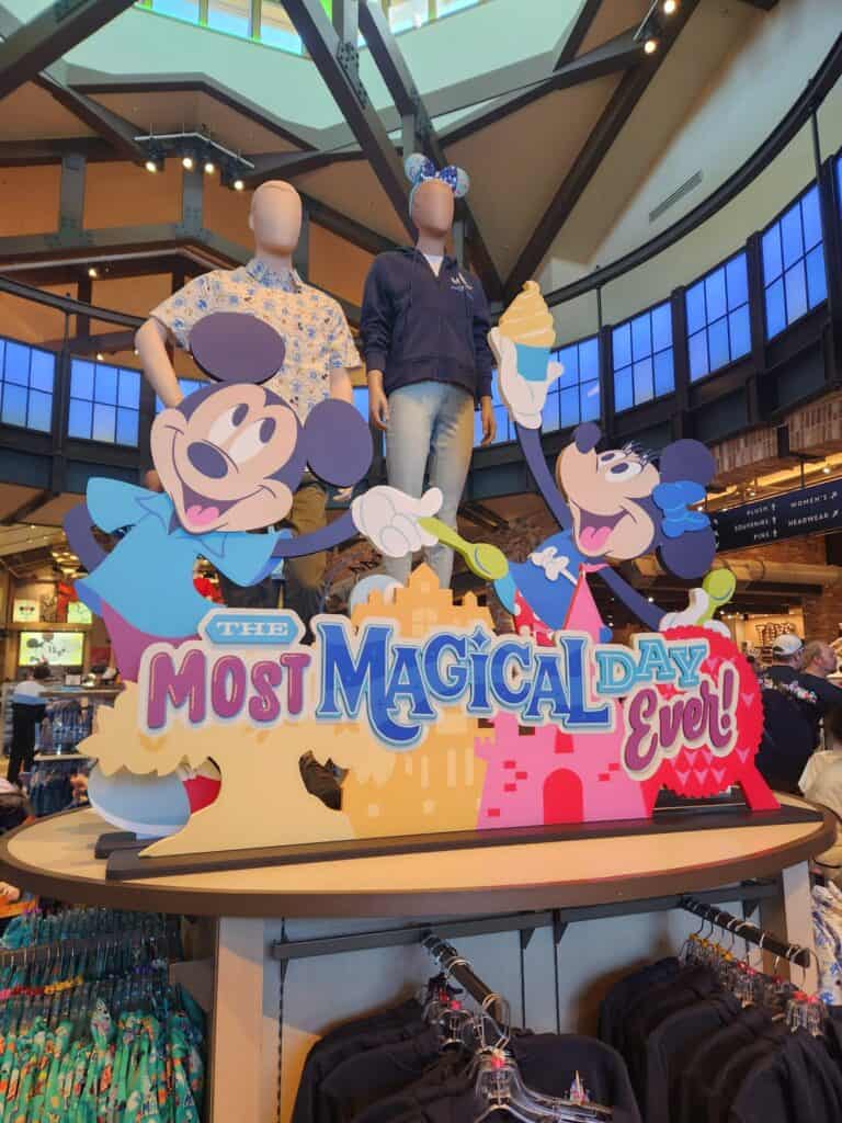 Colorful Disney-themed signage with Mickey and Minnie Mouse characters celebrating "The Most Magical Day Ever".