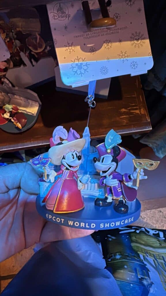 Colorful Disney Mickey and Minnie Mouse figurine celebrating EPCOT World Showcase, perfect for Disney fans.