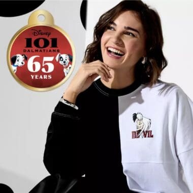 Stylish woman wearing Disney Devil sweatshirt, celebrating 65 years of 101 Dalmatians.