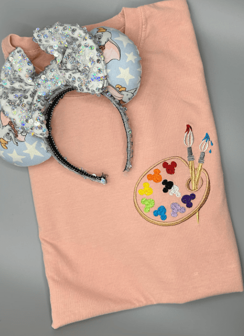 Cute Disney mouse ears with silver sequins and colorful character embroidery, perfect for Disney fans.