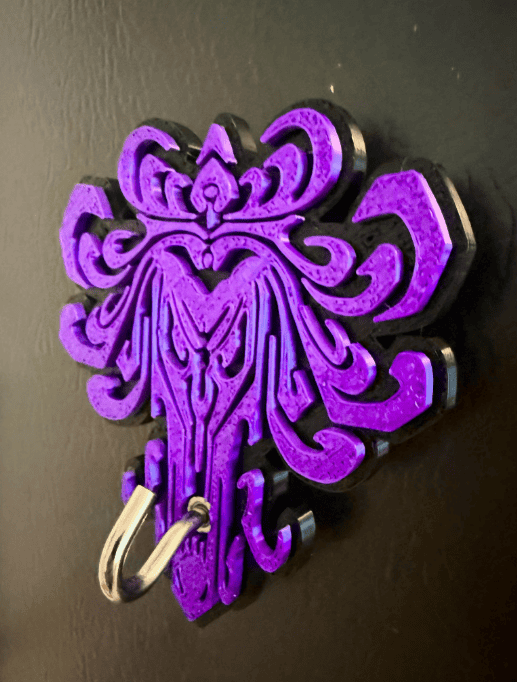 Decorative purple wall hook featuring Disney-inspired intricate design, ideal for magic-themed room decor.