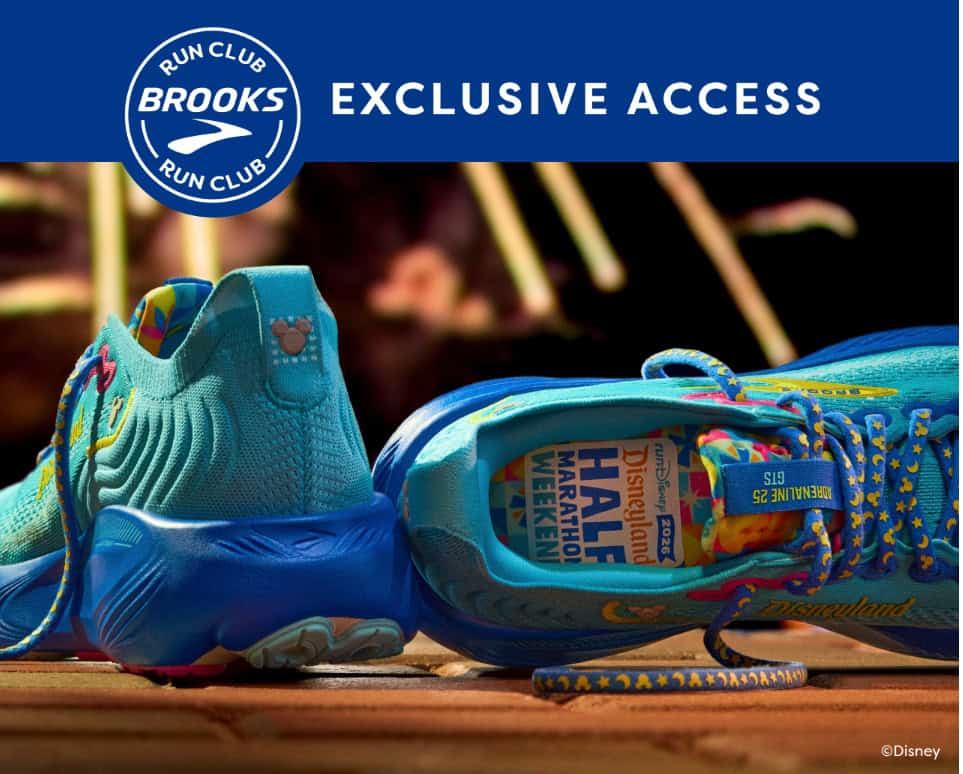 Bright blue Disney RunDisney shoes with commemorative Disneyland 70th anniversary logo, perfect for Disney marathon events.