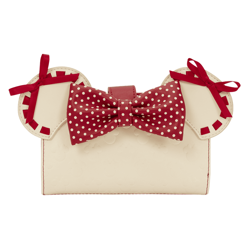 A stylish white purse with red bows and a polka dot bow, perfect for Disney-inspired fashion accessories.