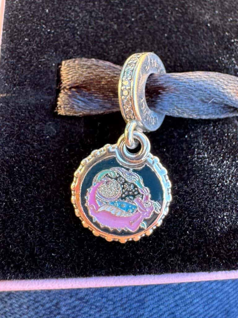 Disney charm bracelet featuring a colorful Disney character pendant with sparkling accents.