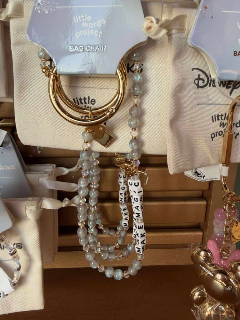 Elegant Disney-inspired jewelry with pearls, gold accents, and “Make Magic” beads.