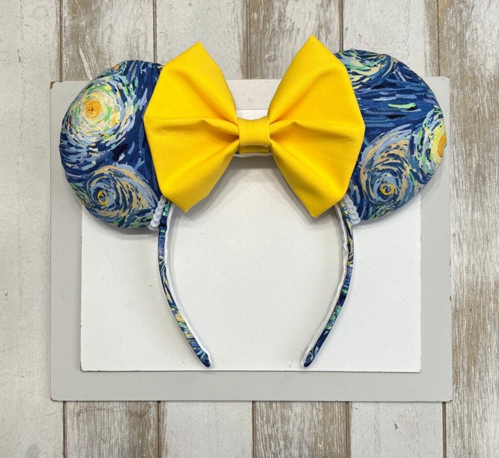 Vibrant Disney Minnie Mouse headband with Starry Night fabric and yellow bow, perfect Disney fashion accessory.