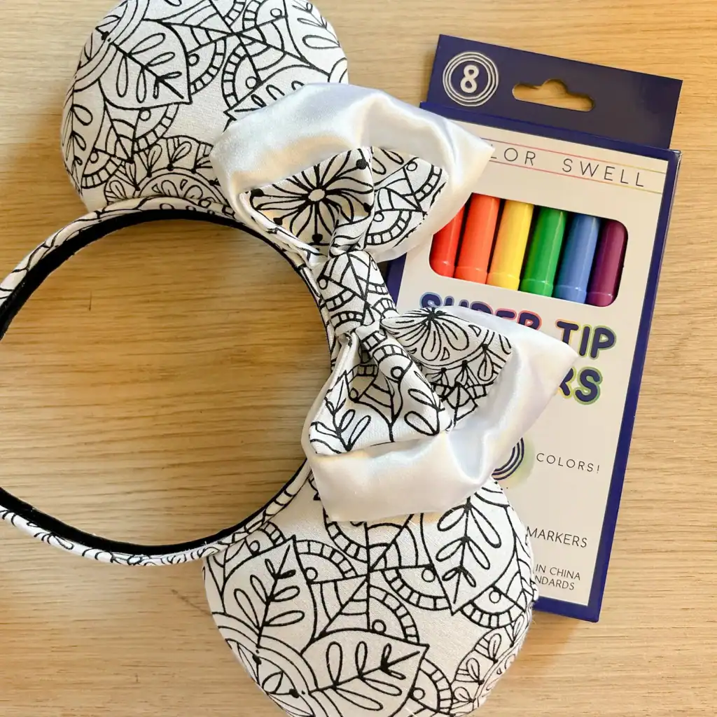 Black and white patterned Disney-themed bow headband with matching face mask for kids and adults.