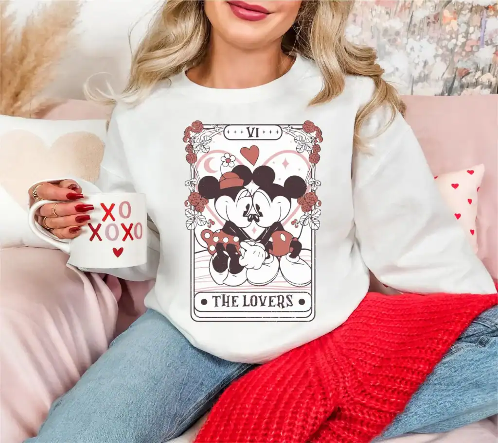 Mickey and Minnie Mouse illustrated as a tarot card, perfect for Disney lovers and fashionistas.