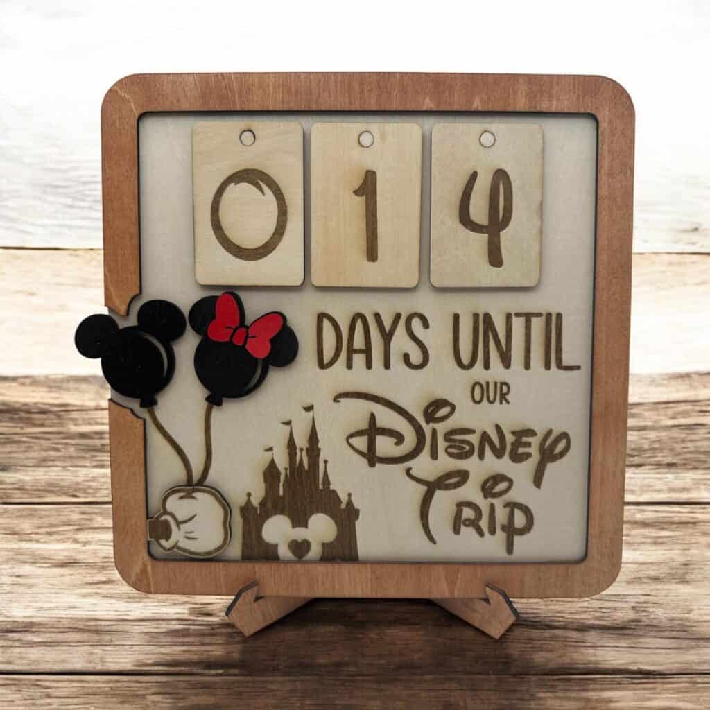 Decorative Disney countdown calendar featuring Mickey Mouse, Minnie Mouse, and a castle for Disney fans.