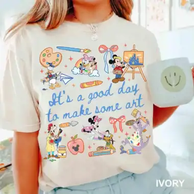 Colorful Disney art t-shirt featuring Mickey, Minnie, Donald, and friends with inspiring text.