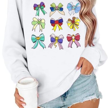 Cozy sweatshirt featuring colorful Disney-inspired bow designs for a stylish look.