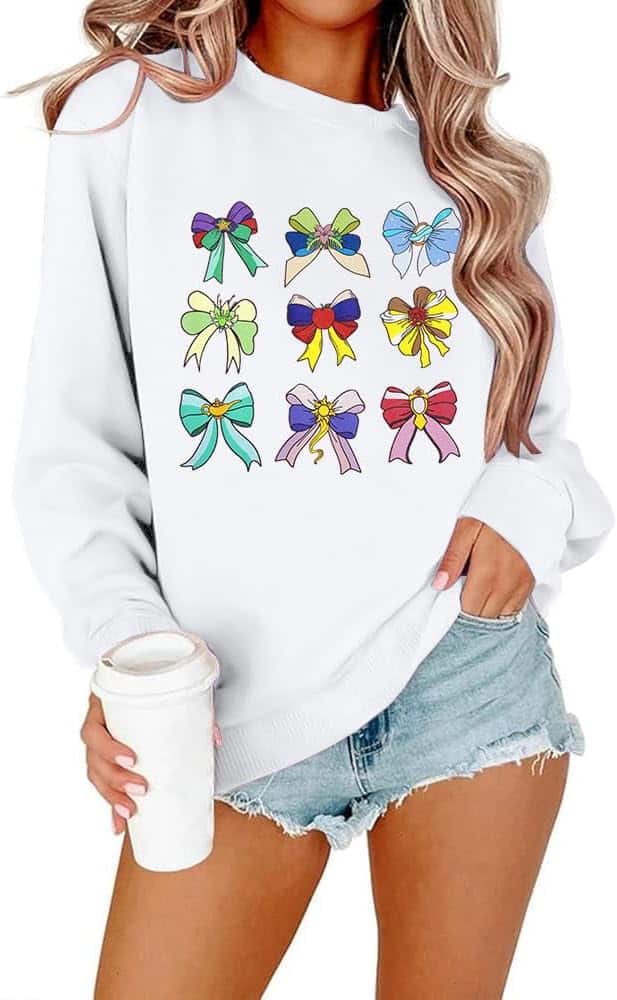 Cozy sweatshirt featuring colorful Disney-inspired bow designs for a stylish look.