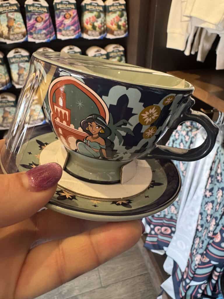 Disney Princess cup and saucer with vibrant, colorful design featuring a princess and floral accents.