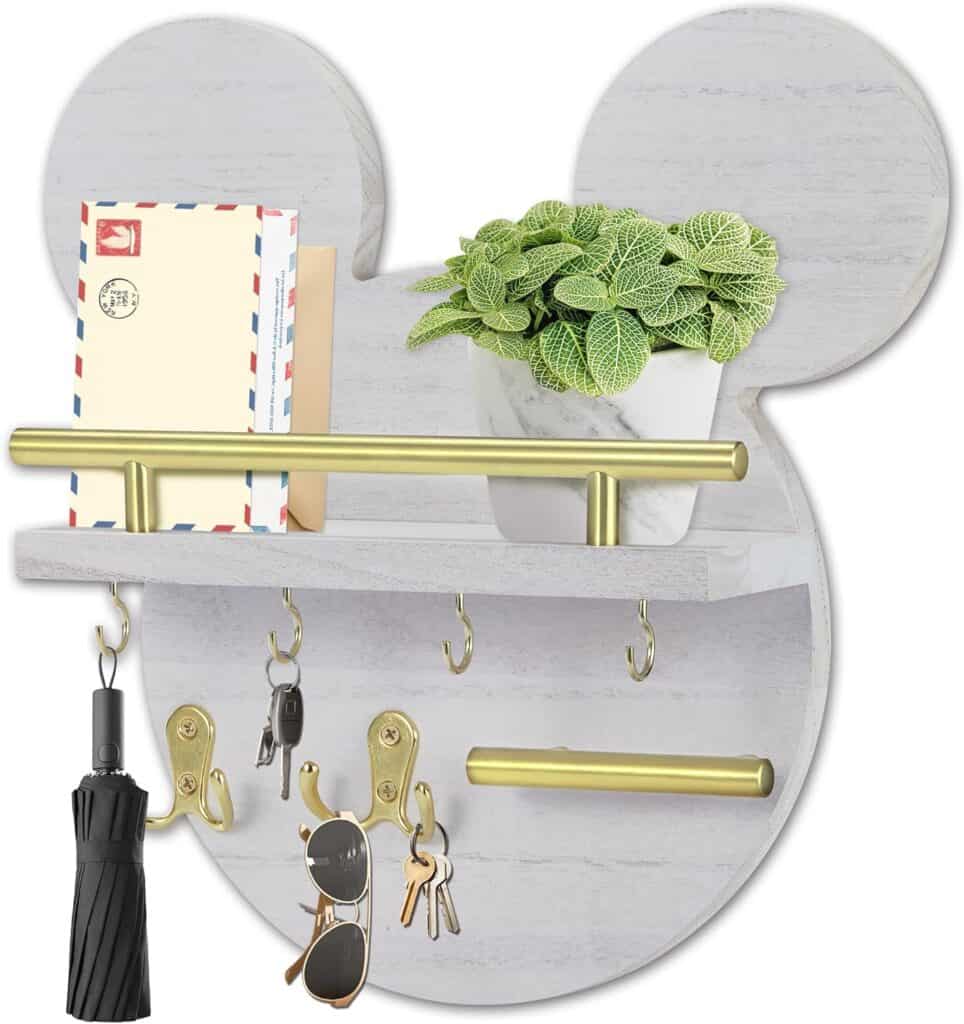 Decorative Mickey Mouse-shaped wall organizer with hooks and shelves for phone, keys, and accessorie.