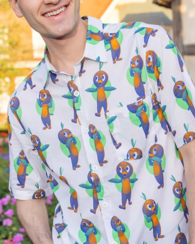 Disney character print shirt with colorful toucan design for men.