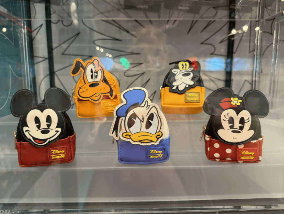 Adorable Disney Loungefly mystery bag charms. Perfect for Disney fans and accessory lovers.