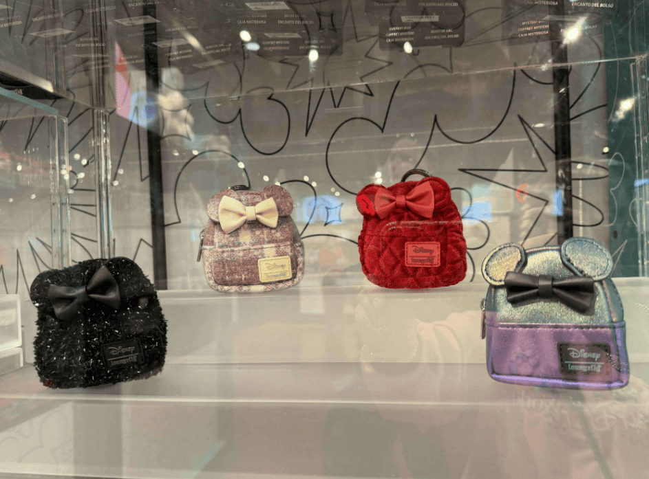 Colorful Disney bag charms with bows, perfect Disney accessories for fans.