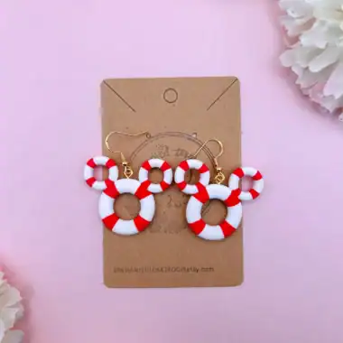 Themed jewelry with red and white lifebuoy design.