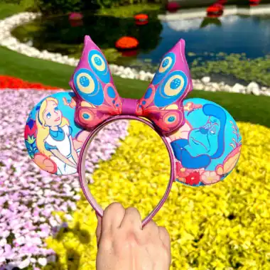 Colorful Disney princess butterfly headband with Ariel and Genie design.