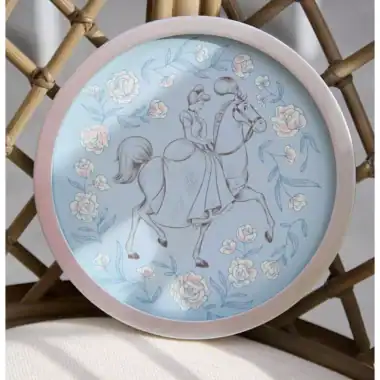 Enchanted girl riding a horse on a decorative Disney-themed plate with floral accents.