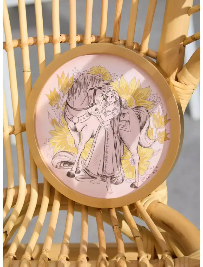 Disney princess with horse illustration on decorative plate.