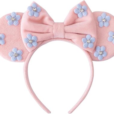 Pink Minnie Mouse ears headband with blue flower accents and bow for Disney fans.