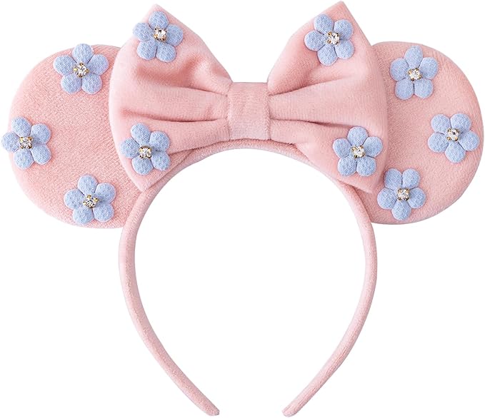 Pink Minnie Mouse ears headband with blue flower accents and bow for Disney fans.